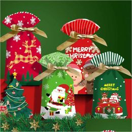 Decoraciones navideñas Nuevo 10 unids Dibujos animados Navidad Dulces Bolsas de regalo Niños Galleta Dulce Plástico Dstring Bolsa Decoraciones navideñas para el año del hogar DHSNC