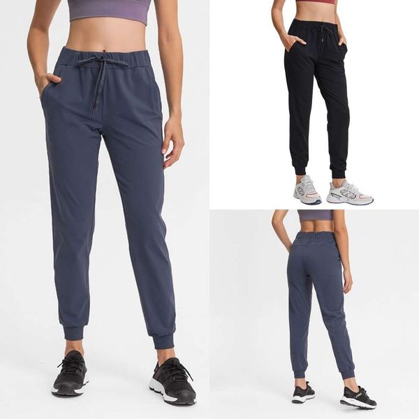 Pantalones de yoga de ajuste delgados clásicos con cordero con bolsillos de fitness de sudor y pantalones deportivos que corren pantalones transpirables y suaves para mujer pantalones