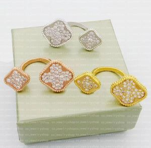 Joyas de diseñador de anillo de trébol clásico de cuatro hojas entre el anillo de los dedos de 18 km anillos de mariposa chapadas damas y niñas Día de San Valentín Regalo de joyería de alta calidad