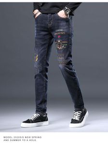 Klassieke heren geborduurde jeans, heren trendy merk jeugd slanke fit kleine voeten casual broek, Koreaanse editie trendy broek