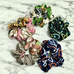 Bandas de goma para el cabello de seda clásicas Joyas de diseño de lujo Diademas para mujer Carta de estrella Bandas para la cabeza elásticas de goma Use deporte de alta calidad