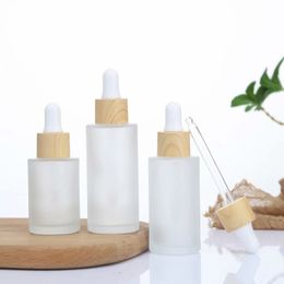 Frosted Essential Oil Glass Bottle Cosmetische Flat Shoulder Dropper Flessen met geïmiteerde bamboe cap 20ml 30ml 50ml 60ml 100ml