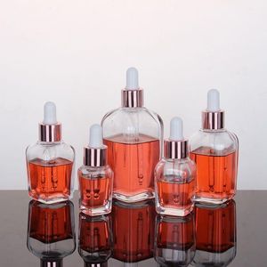 Bouteilles de parfum d'huile essentielle en verre transparent Flacon compte-gouttes carré avec bouchon en or rose 10 ml à 100 ml Wcrpo