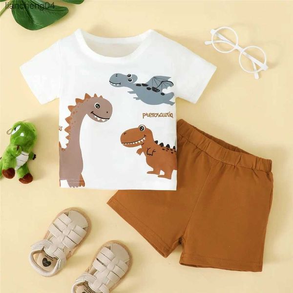 Conjuntos de ropa 0-3 años Bebé niño 2 piezas Conjunto Dinosaurio de dibujos animados Top de manga corta blanco + Pantalones cortos marrones Estilo deportivo lindo Traje de moda guapo