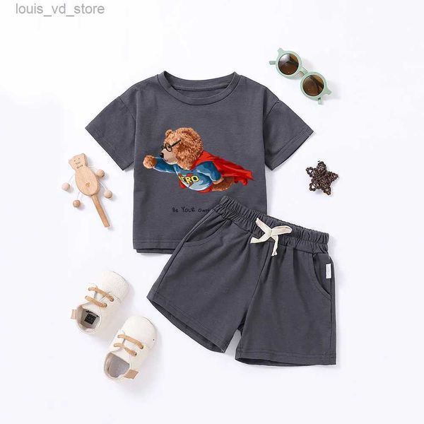 Ensembles de vêtements 2pcs Enfants d'été ensembles de vêtements de dessin animées ours imprimé combinaisons pour garçons filles shorts pour enfants shorts T-shirt 0-5t T240415