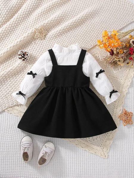 Ensembles de vêtements 2 pièces printemps et automne bébé fille mode mignon confortable style étranger arc blanc à manches longues noir bretelles robe ensemble 231201