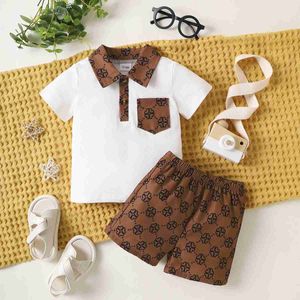 Kledingsets Familie Matching Outfits 2PCS Spring/Summer Boys set korte mouwen knop bedrukte zak topmodieuze baby's met korte mouwen en peuter wx5.23