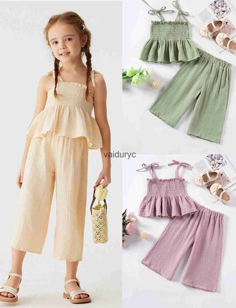 Ensembles de vêtements nouveaux filles d'été Halter Top + Pantalons de jambe larges Ldren Couleur solide Fashion Two-Piece Set Cotton Peplum Clothing Set H240426