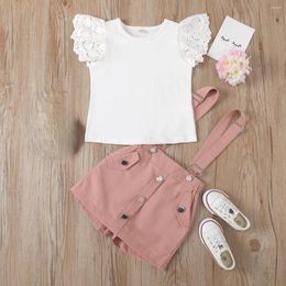 Conjuntos de ropa Solid Hollow Out Fashion Baby 2 Piece O Neck White White Sweet Slewer Kids Tops Button Pocket Casual Couts Spring Summer Girls