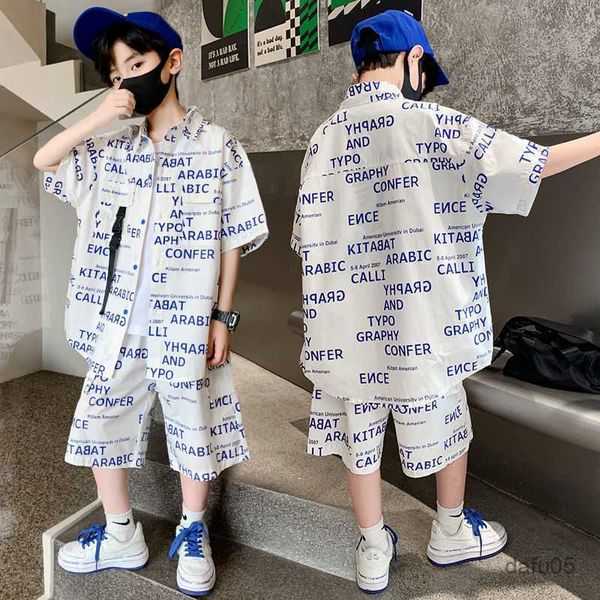 Sets de ropa Juegos de ropa para niños adolescentes Camiseta de manga corta de color negro de verano+pantalones cortos 2pcs Nuevos para niños geniales estilo casual de deportes sueltos 5-14 años R230814