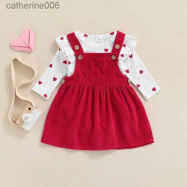 Conjuntos de ropa Día de San Valentín Bebé Traje de dos piezas para niña Patrón de corazón Volantes Manga larga O-cuello Mameluco tops + Falda con tirantes de pana L231202