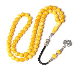 Vêtements en résine jaune tasbih couleur amber perles de prière à la main 8 mm 66 Rosary Metal Pildons Islam Gift Muslim Misbaha Tesbih