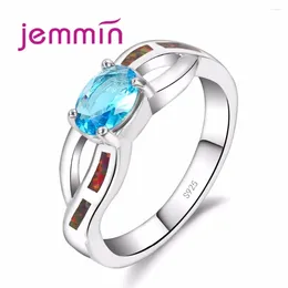 Bagues de cluster Rainbow Fire Opal Ring pour la fiançailles de la fille S925 Crossing Design creux en argent sterling avec un cristal bleu ovale