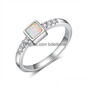 Anneaux de cluster réel 925 Sterling Sier White Fire Opal Clear Zirconia Crystal Engagement Bandes de mariage Femmes S925 Bijoux Cadeaux 3757 Dr Dhqpt