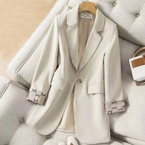 abrigos diseñador mujer abrigo de invierno traje de mujer moda retro mujer serie de color sólido chaqueta profesional botón de grano A temperamento ajustado ropa de mujer de gran tamaño