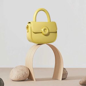 Sac de beignet de bonbons coloré 2024 printemps / été petite femme crossbody texture selle sac à main