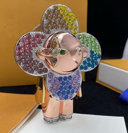 Incrustaciones de cristal de diamante colorido Nuevo astronauta Llavero de flor de girasol Llavero para mujer Parejas Llavero Accesorios para colgar Bolsa Regalo creativo Suministro de joyería de lujo