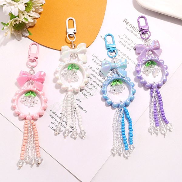 Porte-clés pendentif couronne de fleurs d'orchidées colorées, nœud, perles acryliques mignonnes et douces, pendentifs de sac, étui pour écouteurs, accessoires clés