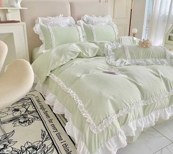 Juegos de ropa de cama de edredones Cama de algodón lavada Conjunto de cuatro piezas Fresco fresco de encaje de encaje de encaje