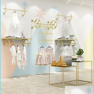 Commercieel meubilair kinderwinkel display plank commerci￫le meubels gouden kinderen stoffen winkelrek muur hangende kleding hangen dhjka
