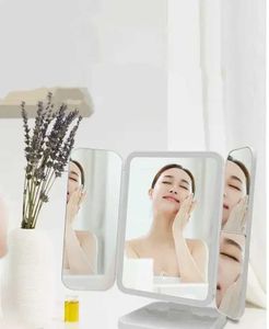 Miroirs compacts LED Miroir de maquillage à trois pliages pliage et rotatif Couleur de beauté portable Lumière Q240509