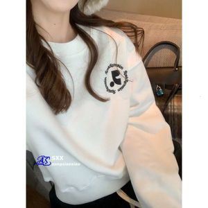 Sweat à capuche à col rond de constant en décréation pour les femmes, courte et petite tendance de haut niveau de style coréen et épicé