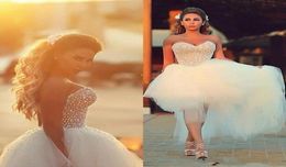 Robes de mariée de haut niveau Corset 2019 perles perles hauts basse tulle plage country country raints nuptiales de luxe arabe saoudien modeste8634991