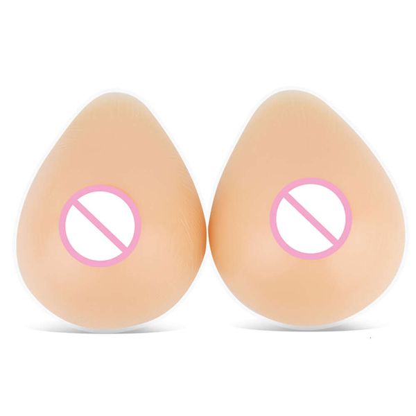 Accesorios de disfraces Venta caliente Formas de senos de silicona Triángulo en forma de lágrima para transexual transgénero Prótesis artificial 300-1400 g / par