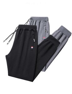 Pantalons de sport pour hommes en coton printemps et automne des pieds lâches de style coréen à la mode grande taille décontractée hommes longs 240412
