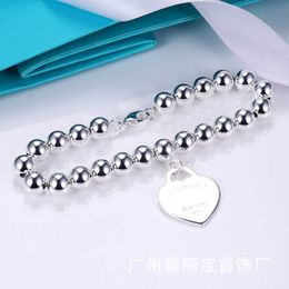 Compteur qualité tiffay Love Peach Heart Bracelet Femme CNC Word Print Anglais en forme Hangtag 8mm Buddha Bead Ball Handstring Avec logo