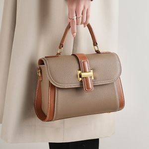 Sac en peau de vache texture avancée sac à main de mode sacoche oblique minorité lumière sac à bandoulière de luxe toutes sortes de sac de filles en cuir véritable sac Litchi en cuir véritable