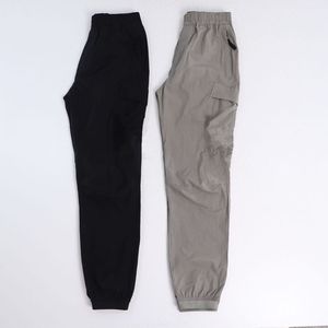 Konng gonng, pantalones de primavera y verano para hombre, marca de moda retro, monos con múltiples bolsillos, mallas para correr, atar los pies