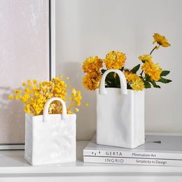 Style de crème Sac binaural nordique simple décoration en céramique fleurs sèches vase de fleurs arrangement de fleurs de salon 240423