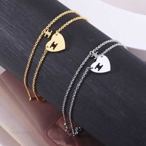 Creatieve en gepersonaliseerde sieraden Vergulde holle hart-triomfboog Ontwerp Dubbellaagse armband voor dames