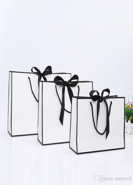Design créatif grand sac en papier kraft blanc à bordure noire avec poignée sac cadeau en papier avec nœud papillon pour faveur de fête de mariage LX014803992792