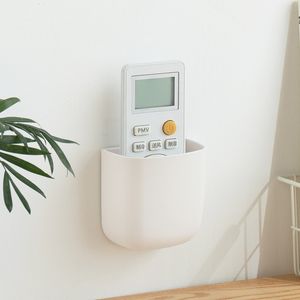 Boîte de rangement en plastique à télécommande à usage quotidien créative pour la maison support de stockage de support de charge Mobile mural en gros