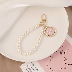 Porte-clés créatif avec nœud en perles pour hommes et femmes, joli pendentif de sac, beau cadeau de fête, porte-clés de voiture