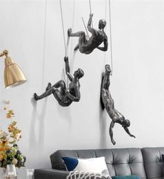 Creative Rock Climbing Men Sculpture Wall Decoraciones colgantes de resina Artesanía de figuras de resina Accesorios de decoración de muebles para el hogar 22011252105