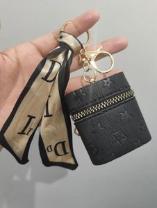 Créativité Presbyopie Car Keychain Coin Purse Pendante Charme Bijoux de la mode Pu en cuir Pu Leather Grid Designer Metal Key Chain