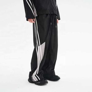 Pantalones de chándal sueltos con costura de poliéster de nailon para hombre, ropa de calle personalizada