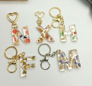 Porte-clés personnalisé en résine de fleurs séchées, 26 alphabet anglais, accessoires de clé en cristal époxy, commerce extérieur