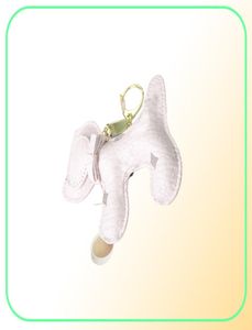 Migne de conception de chien mignon Imprimé Car Keychain Sac Pendentif Bijoux de charme de fleur Solder d'anneau de fleur pour femmes Men Fashion Pu Leather Animal T2298404