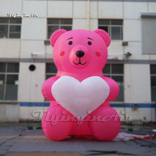 Modèle de mascotte animale de dessin animé de ballon d'ours gonflable de publicité rose géante mignonne avec un grand coeur pour la décoration de parc