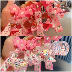 Leuk nieuw product roze prinses, creatieve dobbelstenen in olie, kleine beren drijvend object in olie, drijvende fles, acryl sleutelhanger, tas, hanger