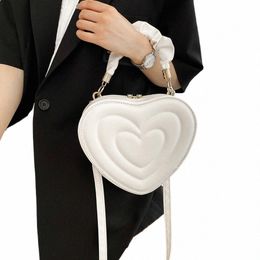 Migne Peach Love Women Crossbody Bag Fi Coeur en forme de sac à main pour dames 2023 Luxury Pu Soil Purse Femme Sac à main haut de gamme 65rz #
