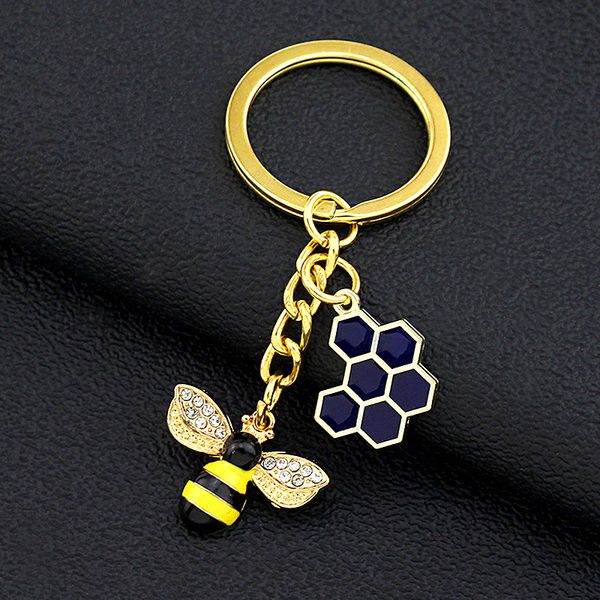 LLavero de abeja con diamantes de imitación en forma de panal hexagonal para mujer