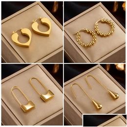 Boucles d'oreilles de cerceau de verrouillage de coeur doré 14k.