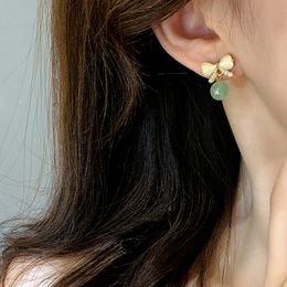 Dangle Chandelier 2023 2023 nouveau noeud boucles d'oreilles en pierre oeil de chat femme haut de gamme Niche tempérament Simple perle boucles d'oreilles vert rétro boucles d'oreilles délicates