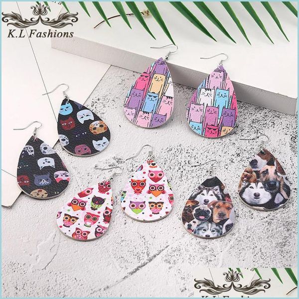 Cuelgue el diseño de la lámpara Pendiente de cuero con estampado animal para mujeres niñas Boho Gato Perro Cuelgue los pendientes de gota Oval Gota de agua Oreja Creativ Dhzm6