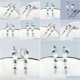 Dangle Lustre Élégant Bleu Et Blanc Fleur Boucles D'oreilles Longue Gland Perle Papillon 925 Sier Femmes Bijoux À La Main Émail Goutte D Dhfdw